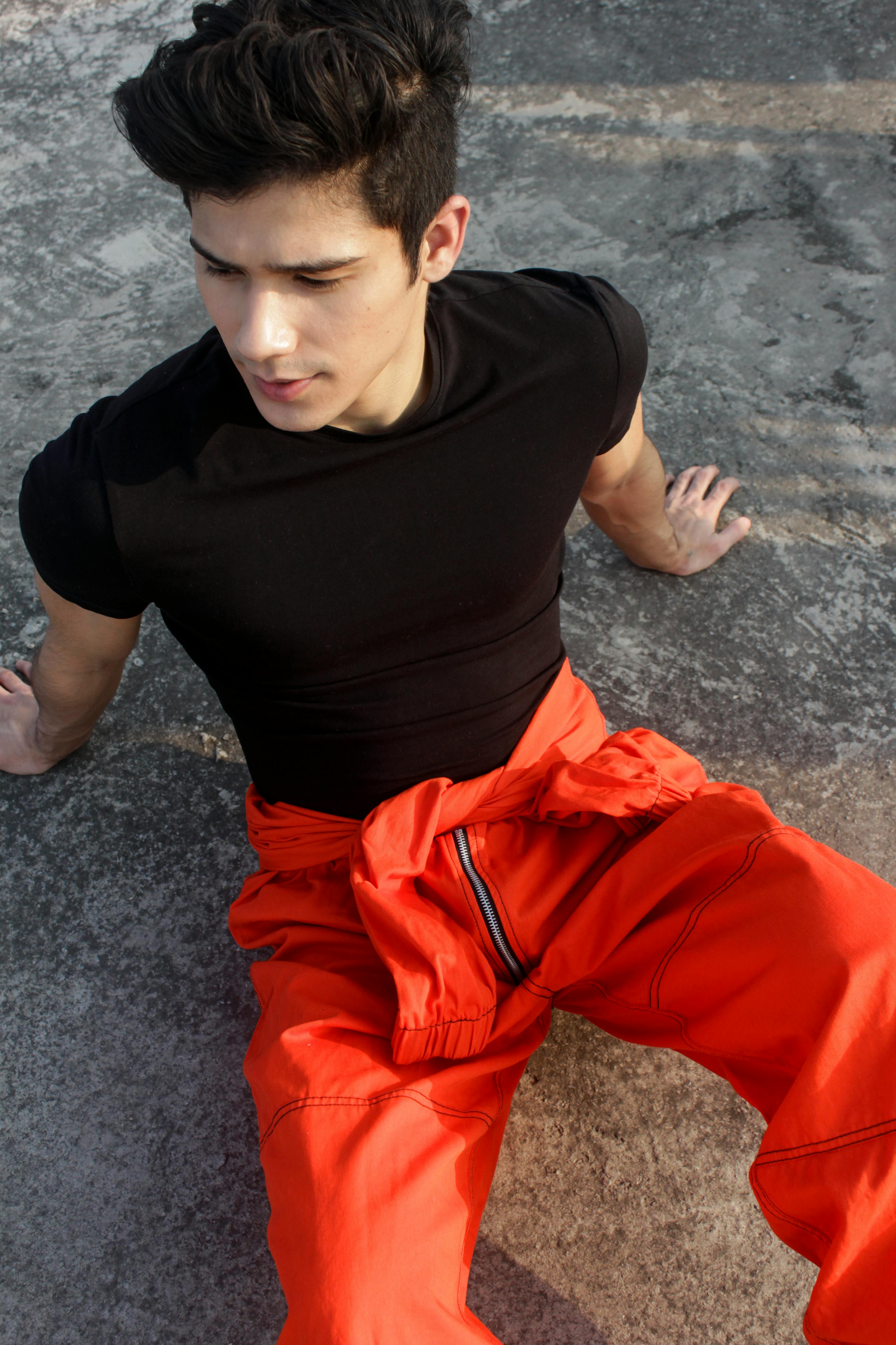 Male model in black shirt and white pants on Craiyon
